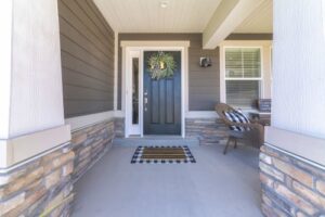 blue-toned front door with sidelite